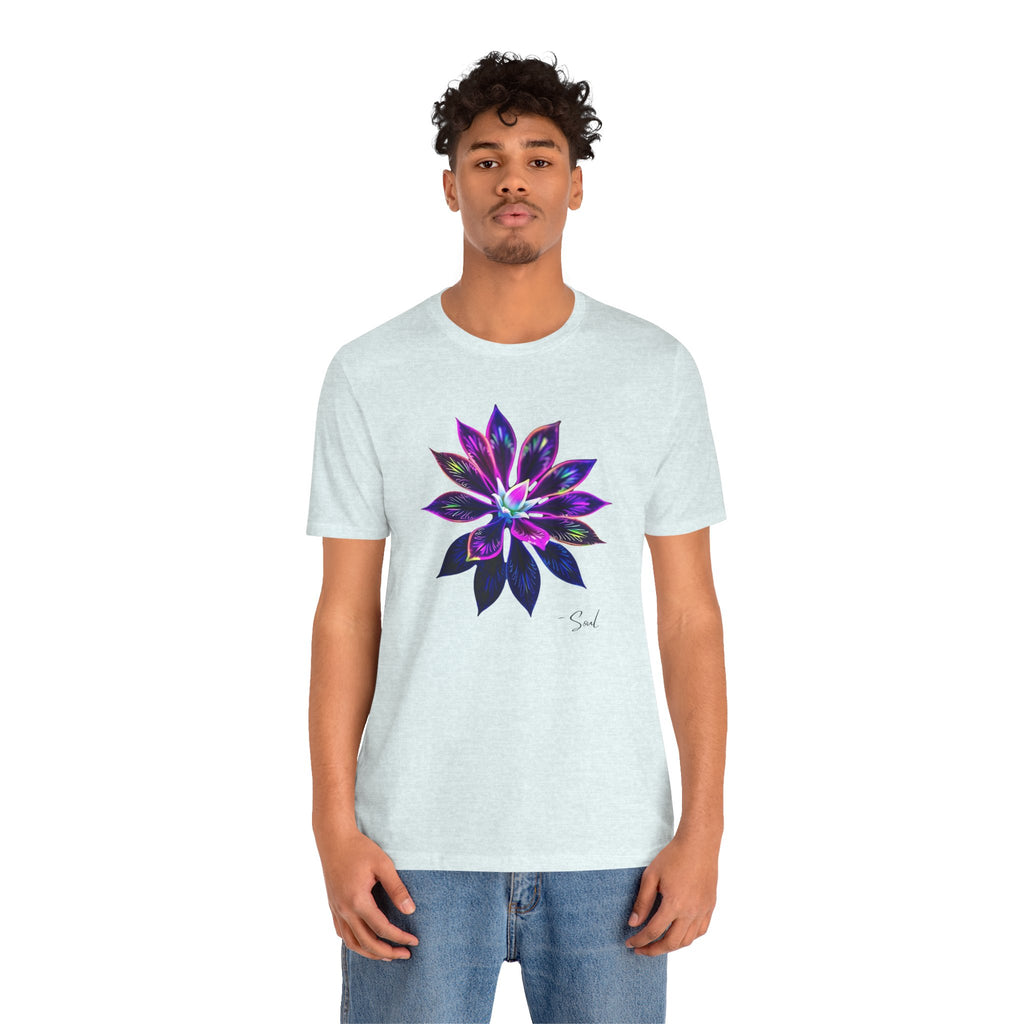 A man in a t-shirt featuring a graphic, bold, psychedelic floral design.