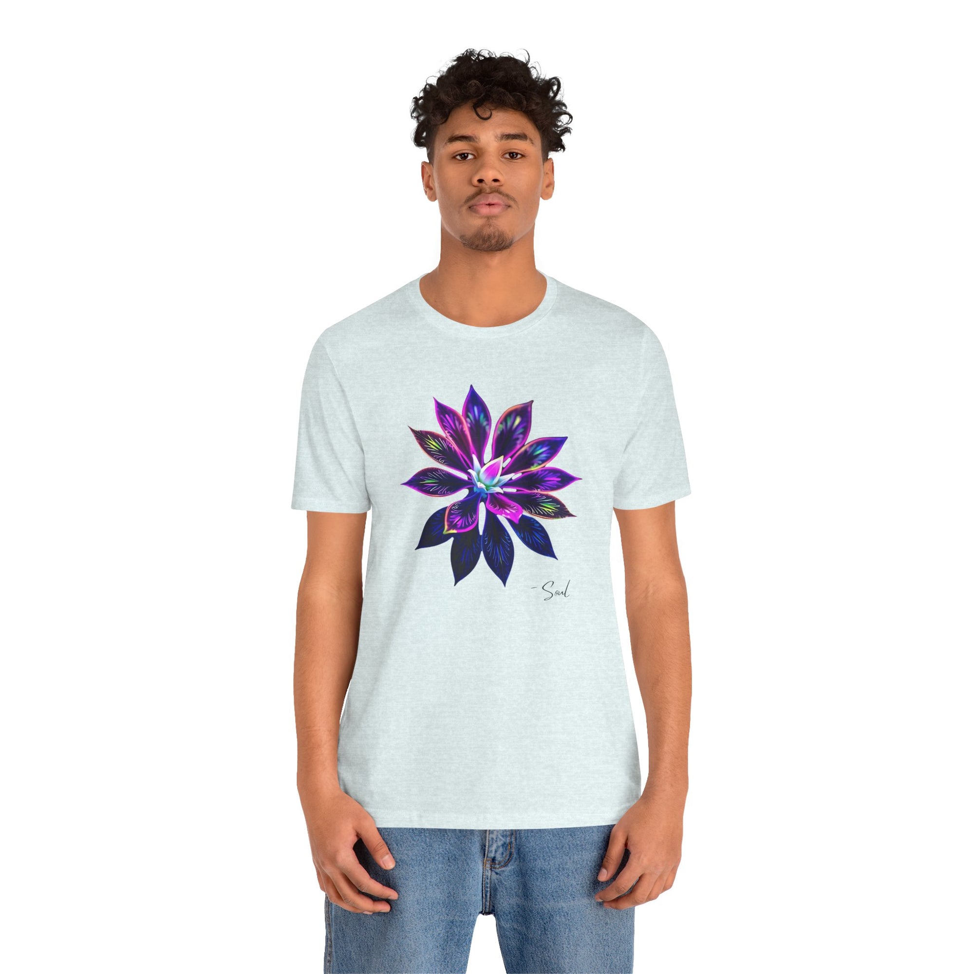 A man in a t-shirt featuring a graphic, bold, psychedelic floral design.