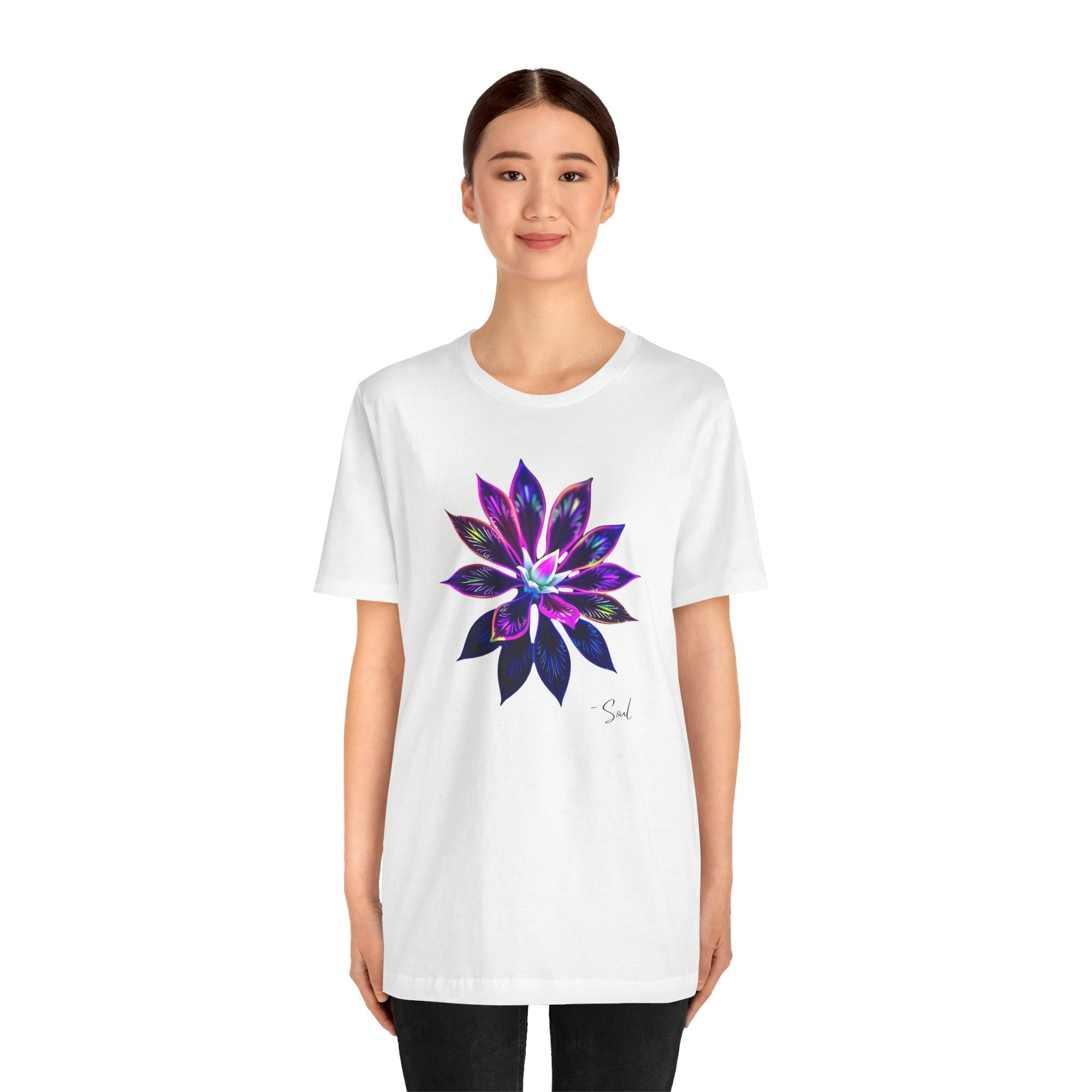 A woman in a t-shirt featuring a bold, psychedelic floral design.