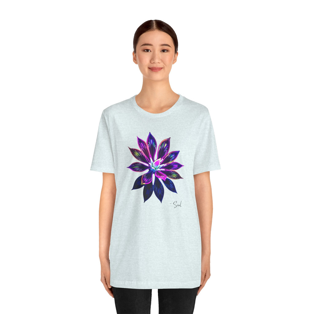 A woman in a t-shirt featuring a graphic, bold, psychedelic floral design.